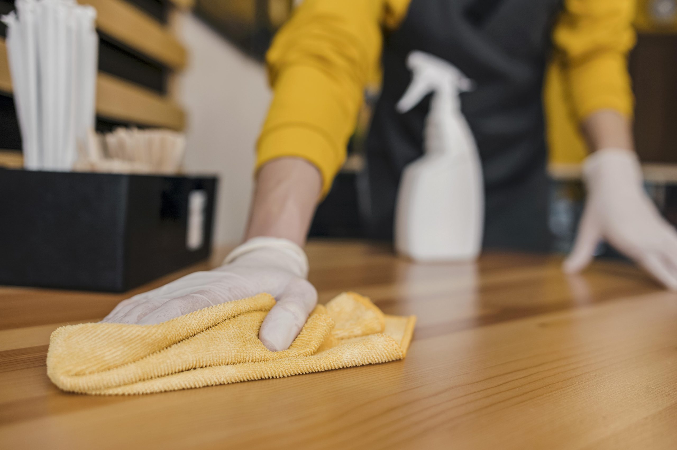 front-view-barista-cleaning-table